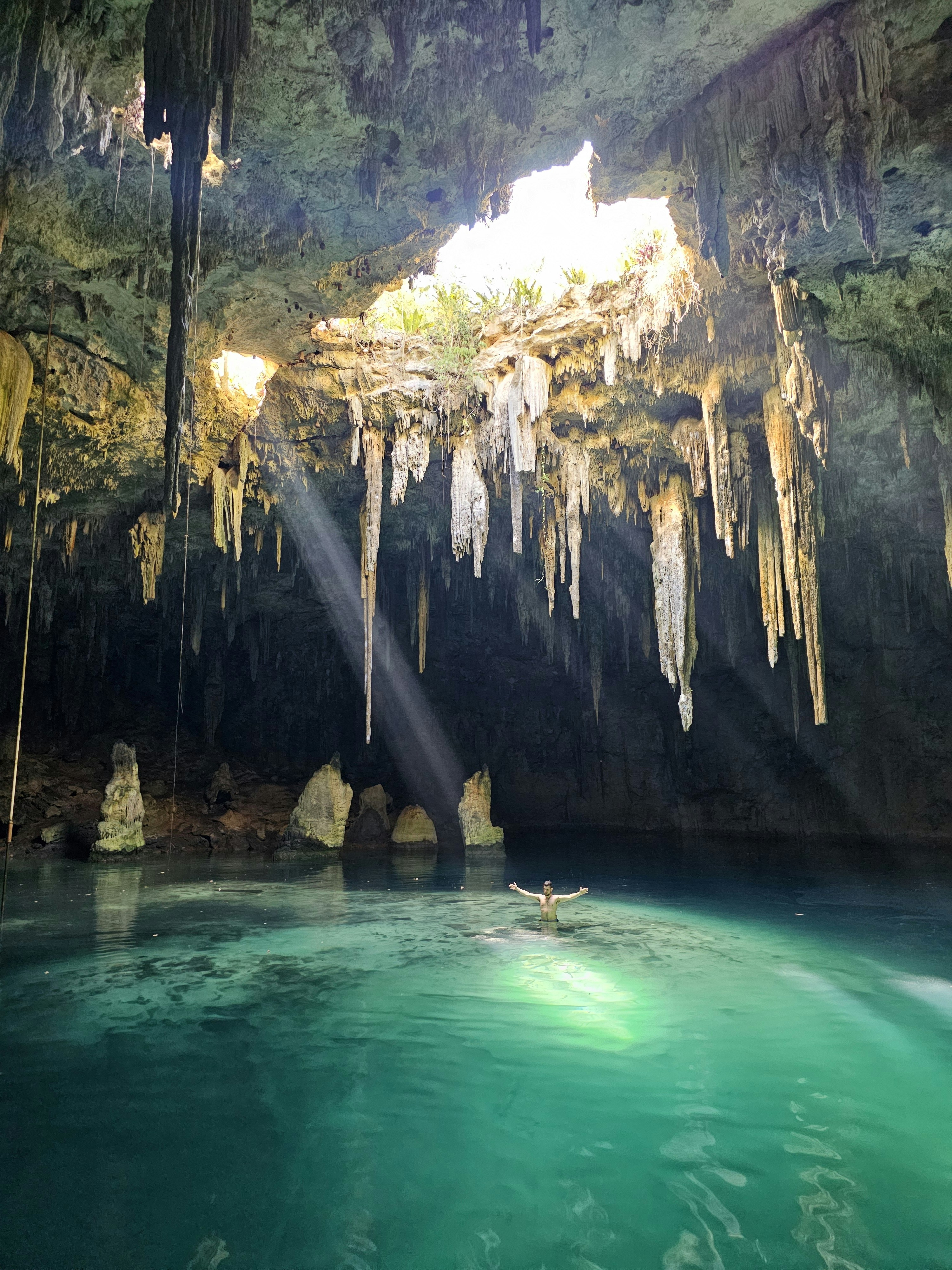 A cenote sinkhole with crystal-clear turquoise water in the Yucatan, Mexico