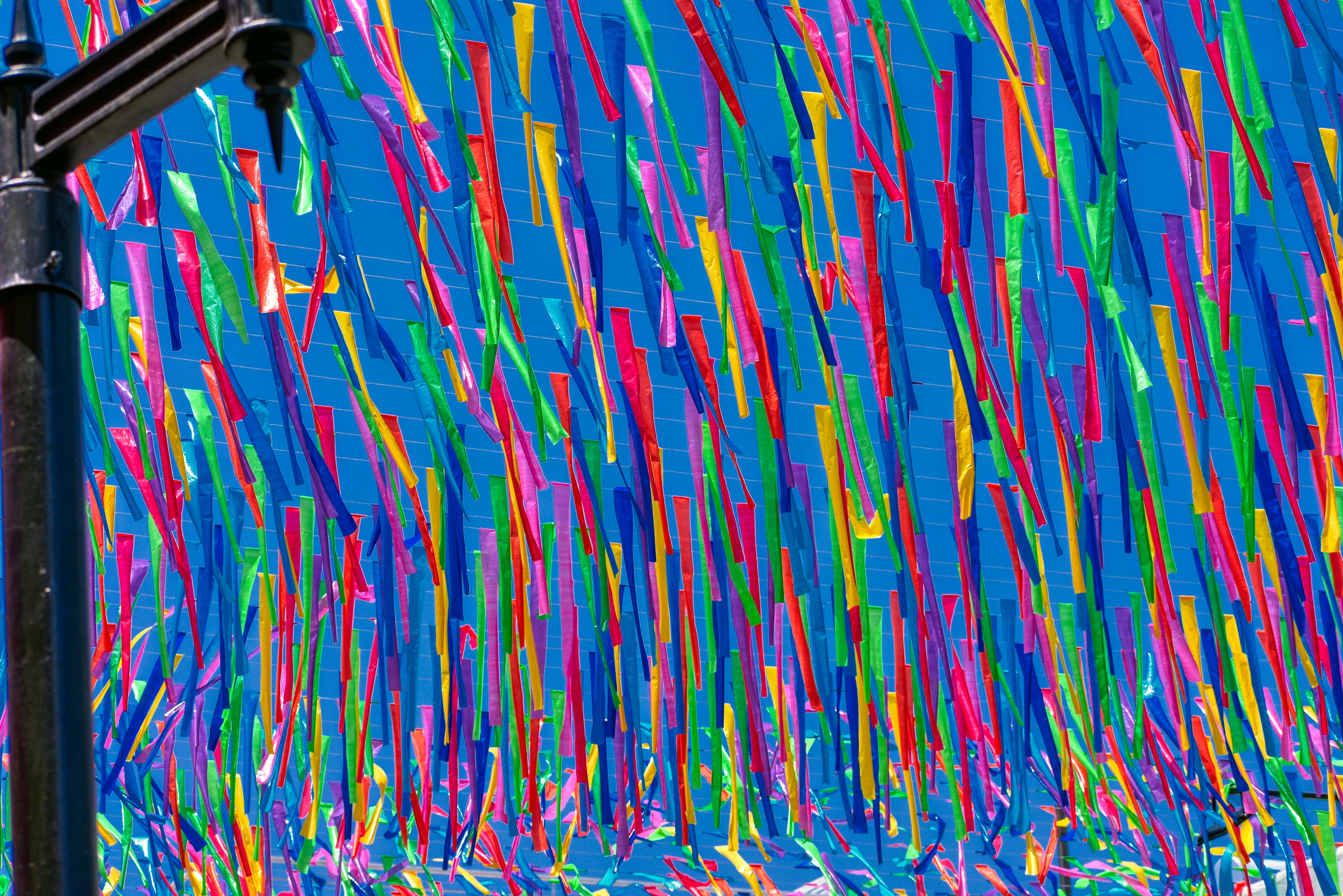 A colorful street decorated with paper streamers in Oaxaca, Mexico