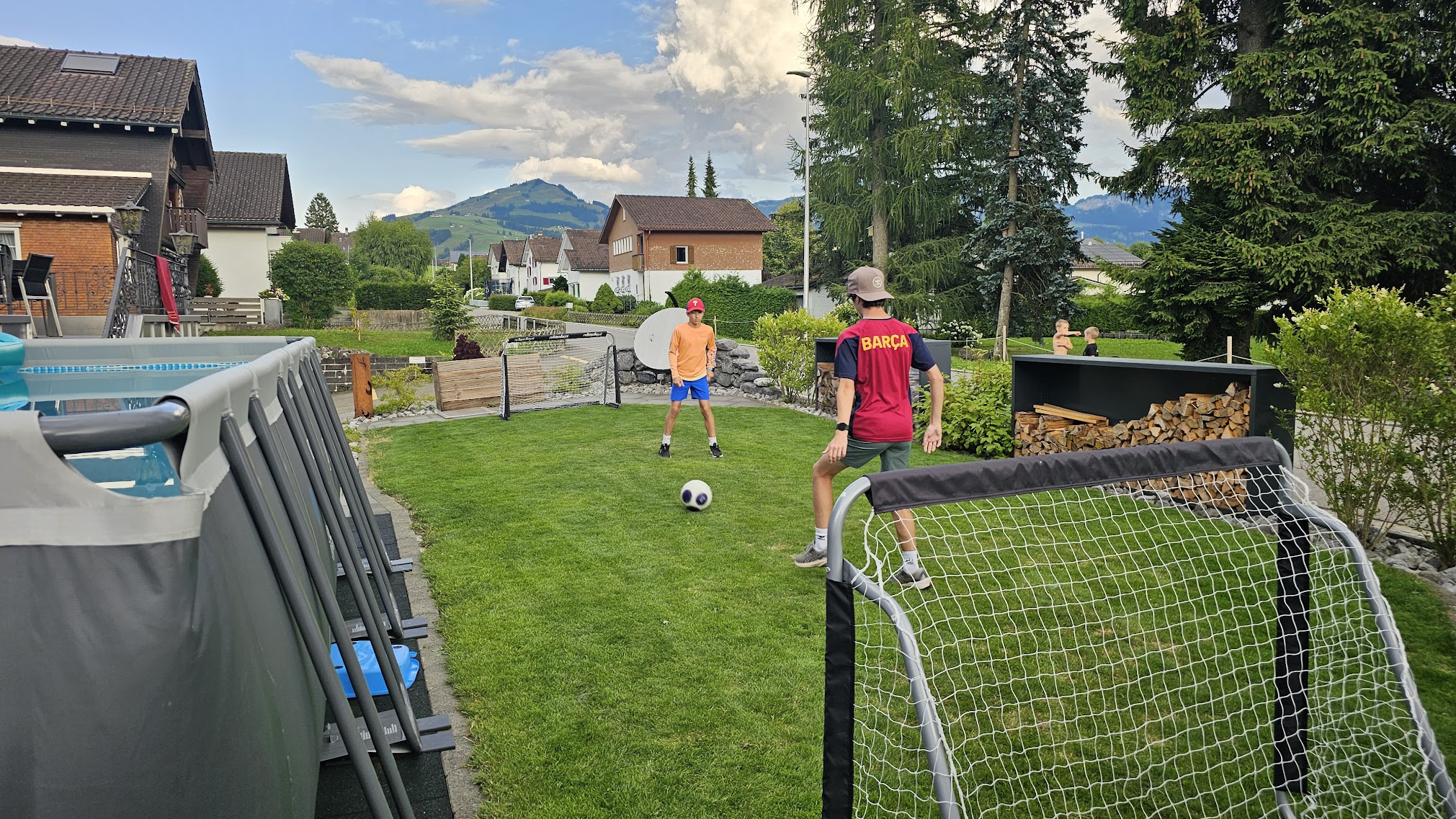 Kids playing a pickup soccer game in an Appenzell village, Switzerland