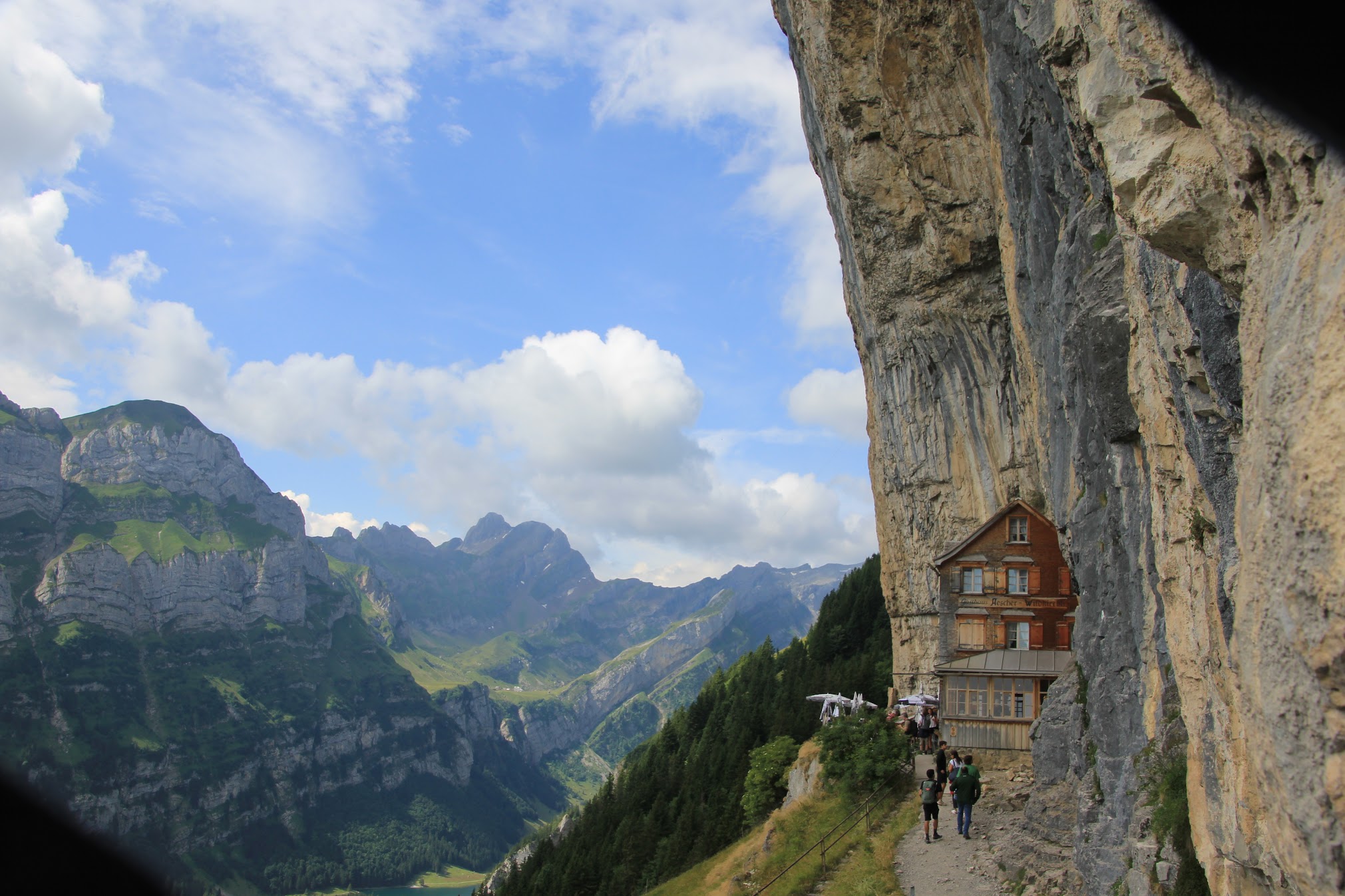 The Aescher Gasthaus clinging to a rock face above the Appenzell valley, Switzerland